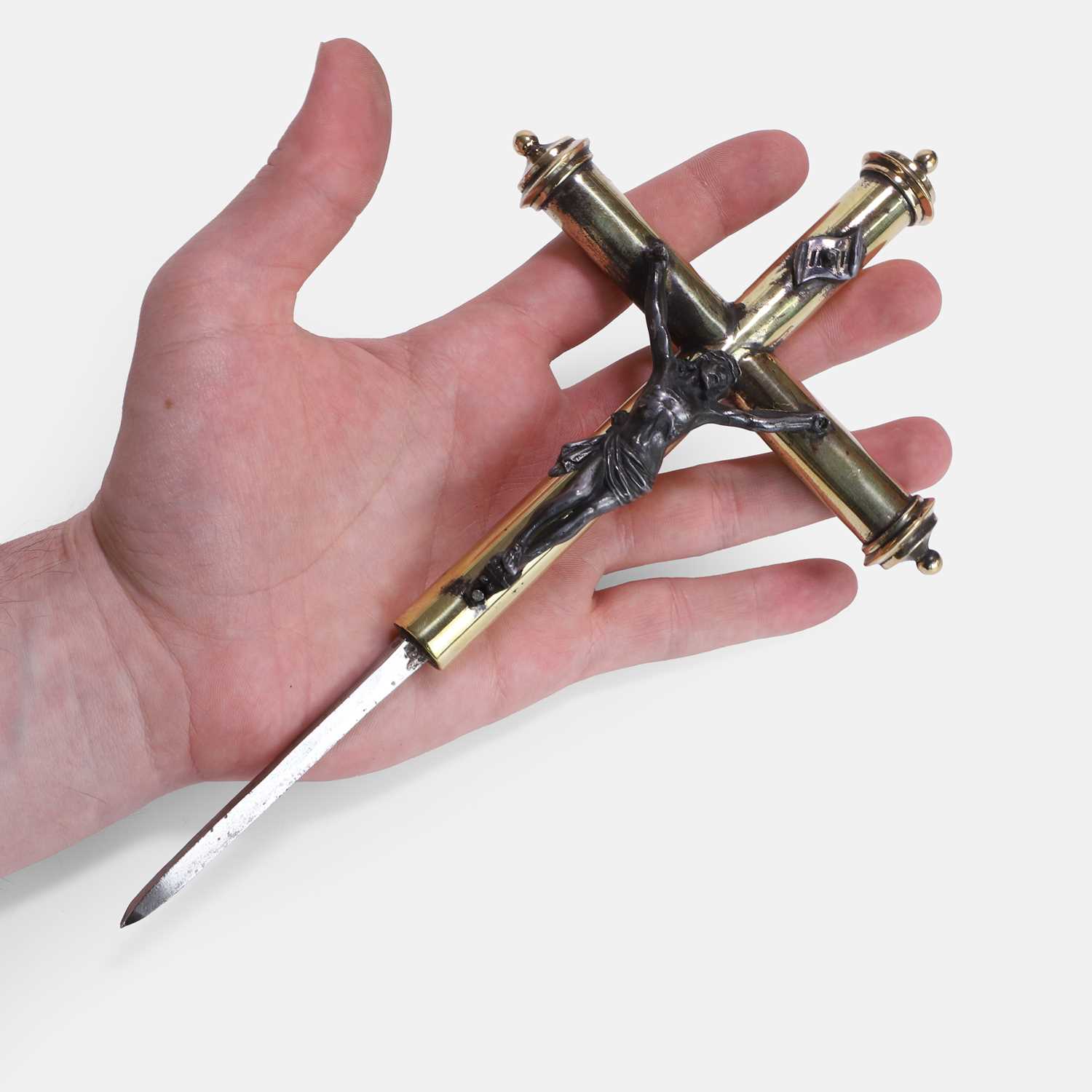 Lot 111 - An unusual two-toned brass crucifix with a secret hidden dagger
