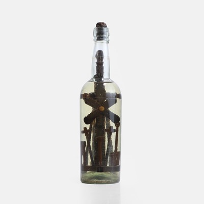 Lot 128 - A bottle of holy water containing the tools of Christ