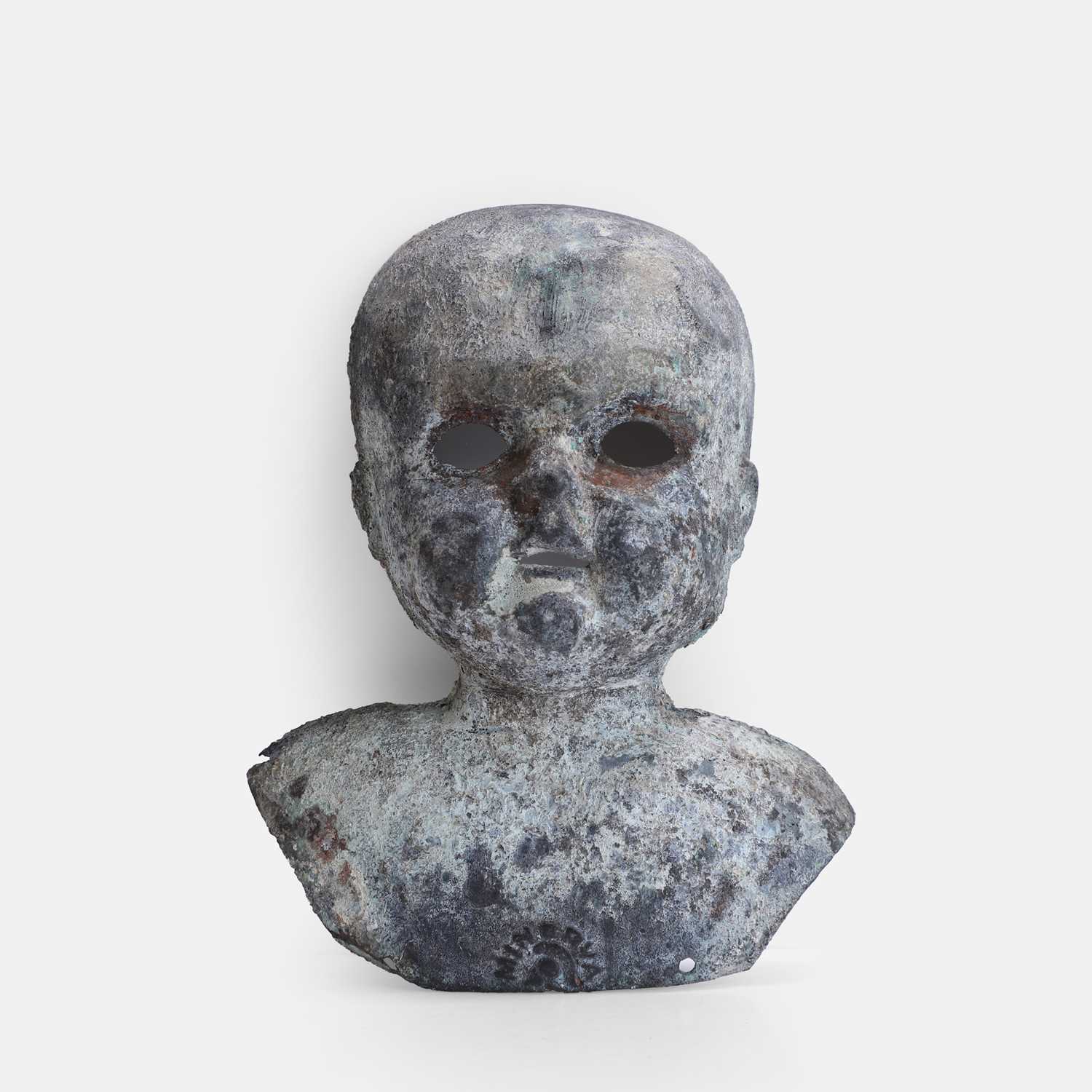 Lot 84 - A cast metal doll's head mould