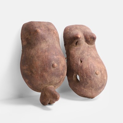 Lot 478 - Two African male and female carved wood fertility body masks