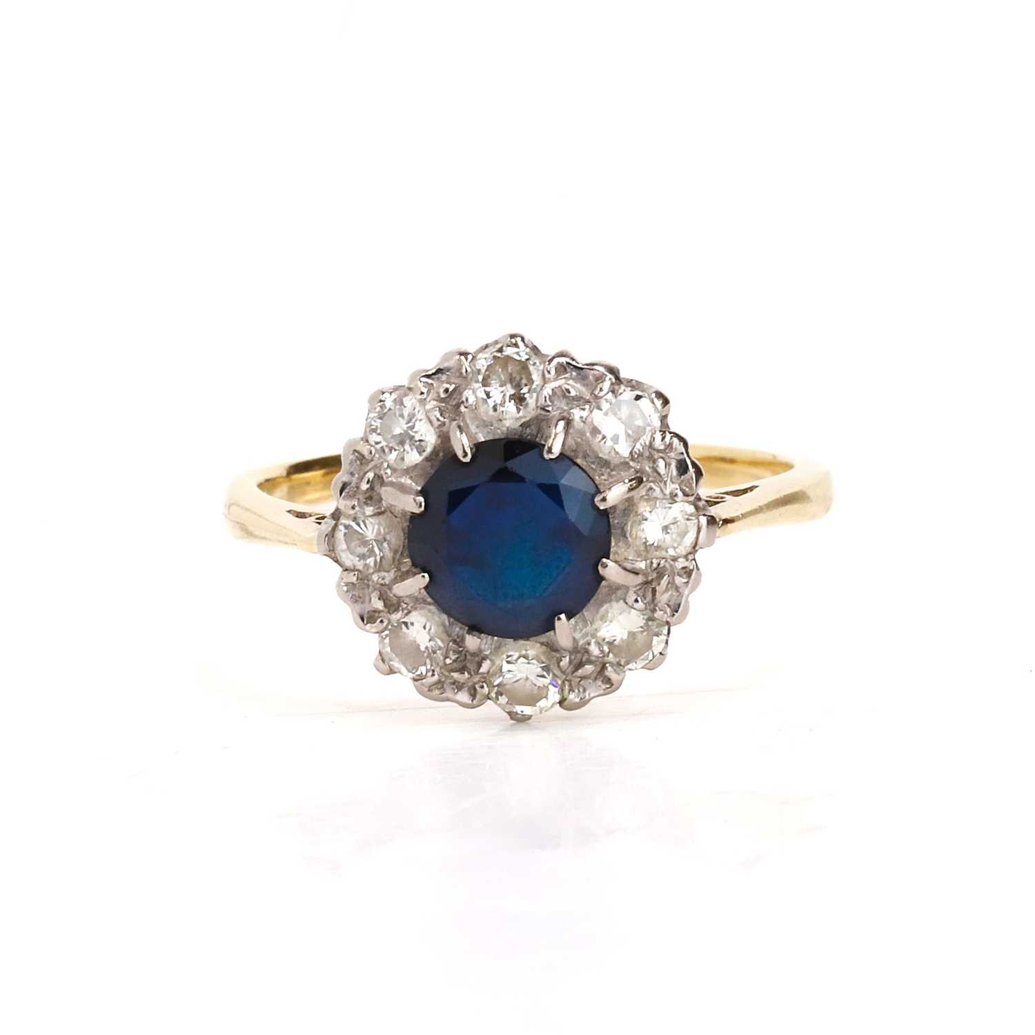 Lot 76 - A sapphire and diamond cluster ring