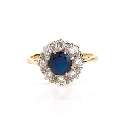 Lot 76 - A sapphire and diamond cluster ring