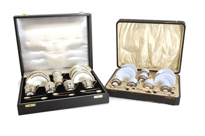 Lot 38 - Two cased silver mounted porcelain coffee services