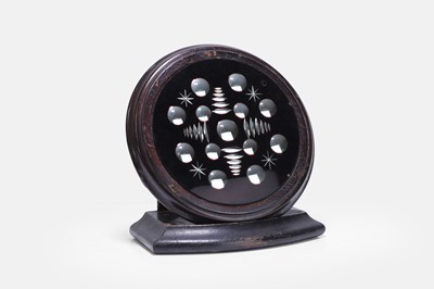 Lot 393 - A ruby-red sorcerer's mirror