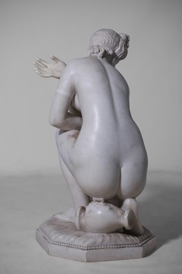 Lot 53 - A large marble figure of 'The Crouching Venus'