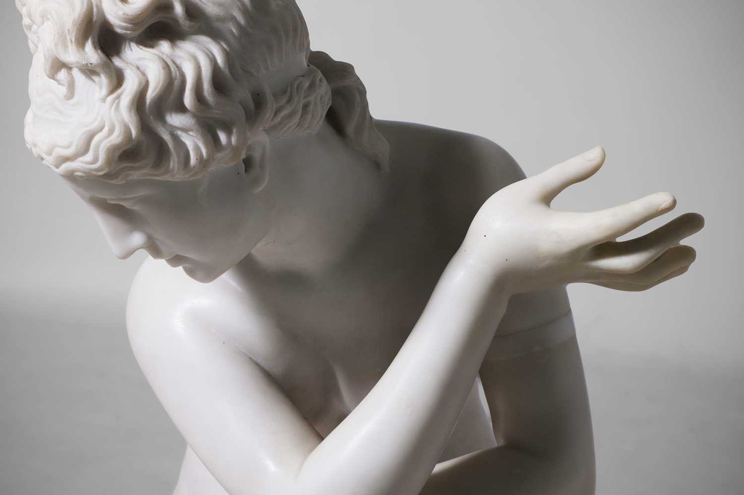 Lot 53 - A large marble figure of 'The Crouching Venus'