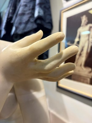 Lot 53 - A large marble figure of 'The Crouching Venus'