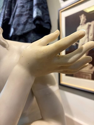 Lot 53 - A large marble figure of 'The Crouching Venus'