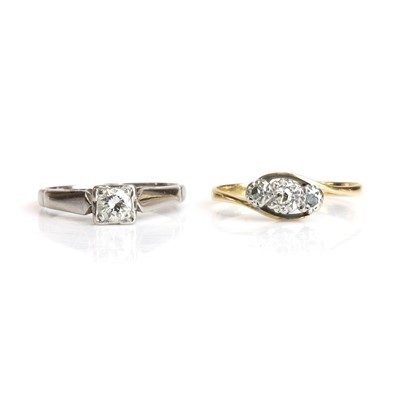 Lot 236 - A diamond single stone ring and a diamond three stone ring