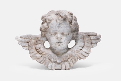 Lot 652 - A carved wooden and painted cherub's head sculpture