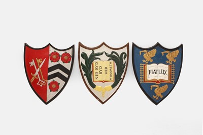 Lot 403 - Three painted wood armorial shields