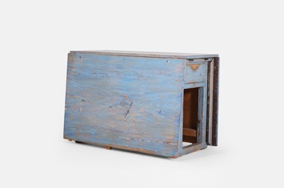 Lot 134 - A painted pine drop-leaf table