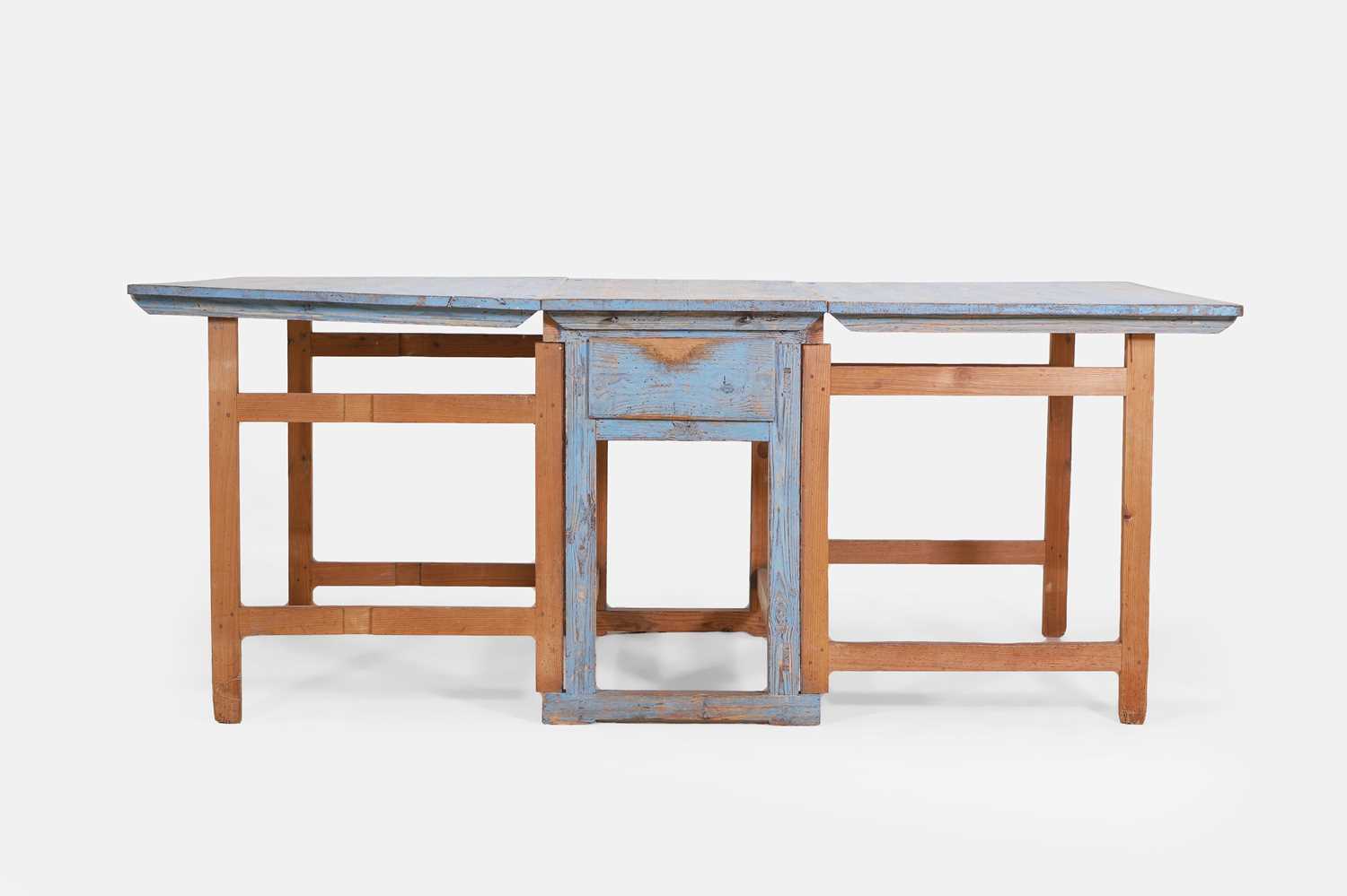 Lot 134 - A painted pine drop-leaf table
