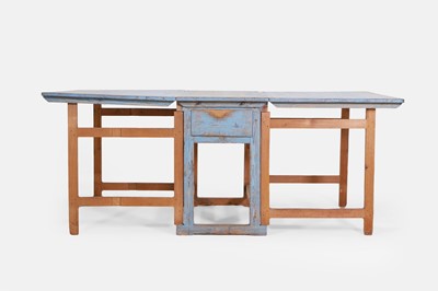 Lot 134 - A painted pine drop-leaf table