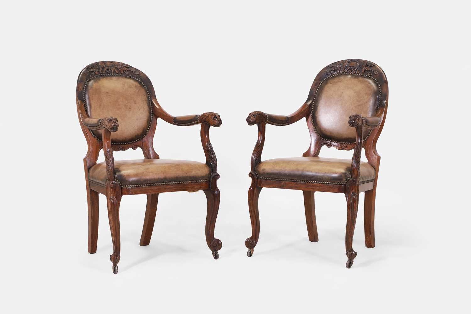 Lot 60 - A pair of Anglo-Indian armchairs