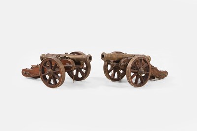 Lot 389 - A pair of brass desk cannons