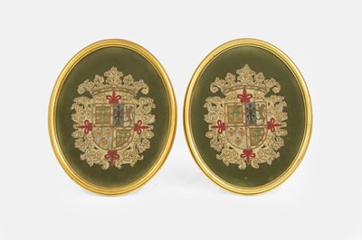 Lot 154 - A pair of armorial needlework panels
