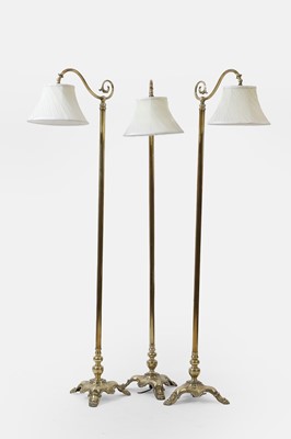 Lot 354 - Three gilt-metal standard lamps