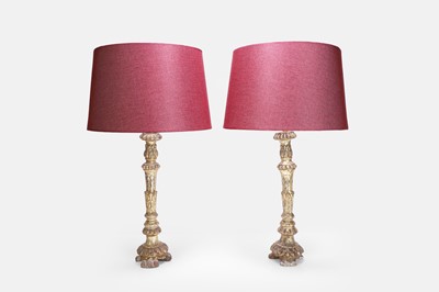 Lot 347 - A pair of rococo carved giltwood candlestick lamps