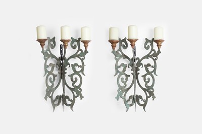 Lot 28 - A pair of patinated pierced-metal wall lights