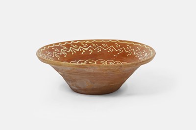 Lot 633 - A large slipware bowl