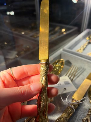 Lot 86 - A silver-gilt flatware service
