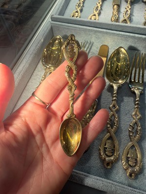 Lot 86 - A silver-gilt flatware service