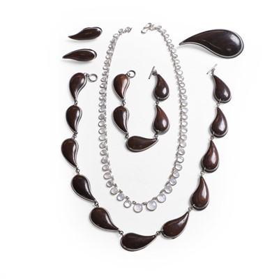 Lot 296 - A hardwood and metal inlay parure and a graduated moonstone necklace