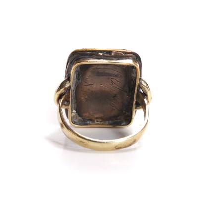 Lot 2 - An antique composite ring with a garnet tablet