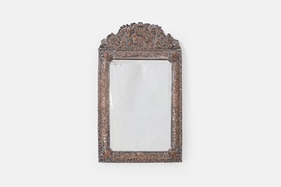 Lot 428 - A silvered-copper repoussé mirror