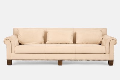 Lot 114 - A three-seater sofa in the style of Christopher Guy