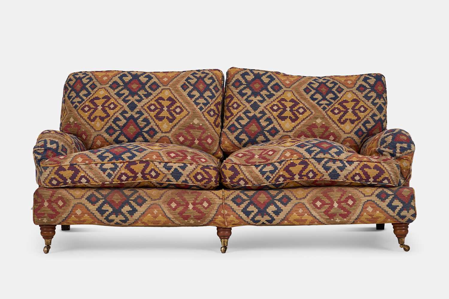 Lot 79 - An upholstered two-seater sofa in the Howard & Sons style