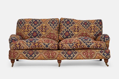Lot 79 - An upholstered two-seater sofa in the Howard & Sons style