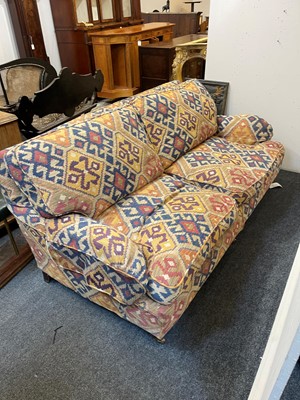 Lot 79 - An upholstered two-seater sofa in the Howard & Sons style