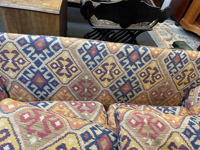 Lot 79 - An upholstered two-seater sofa in the Howard & Sons style