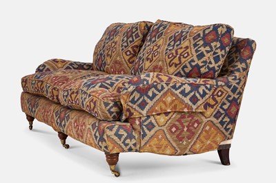 Lot 79 - An upholstered two-seater sofa in the Howard & Sons style