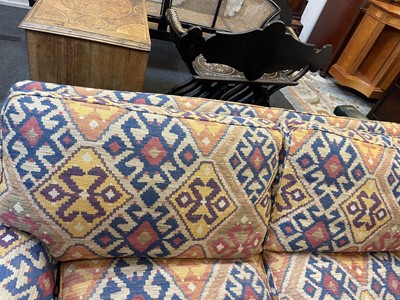 Lot 79 - An upholstered two-seater sofa in the Howard & Sons style