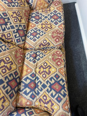 Lot 79 - An upholstered two-seater sofa in the Howard & Sons style
