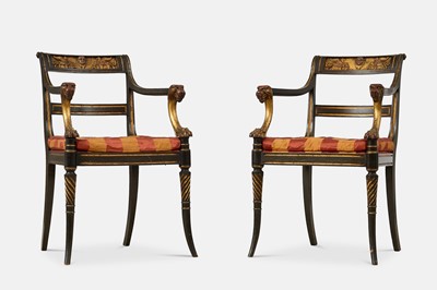 Lot 207 - A pair of Regency-style painted and parcel-gilt wooden elbow chairs