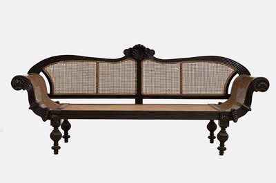 Lot 328 - A carved ebony settee