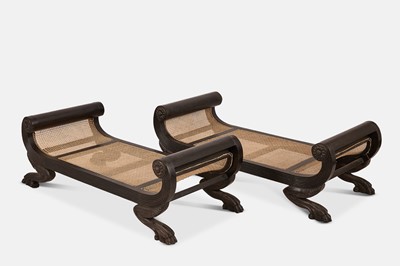 Lot 303 - A pair of carved ebony stools