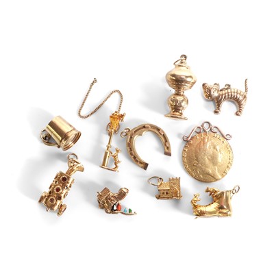 Lot 313 - A collection of gold charms