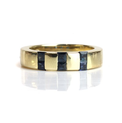 Lot 80 - A sapphire set band ring