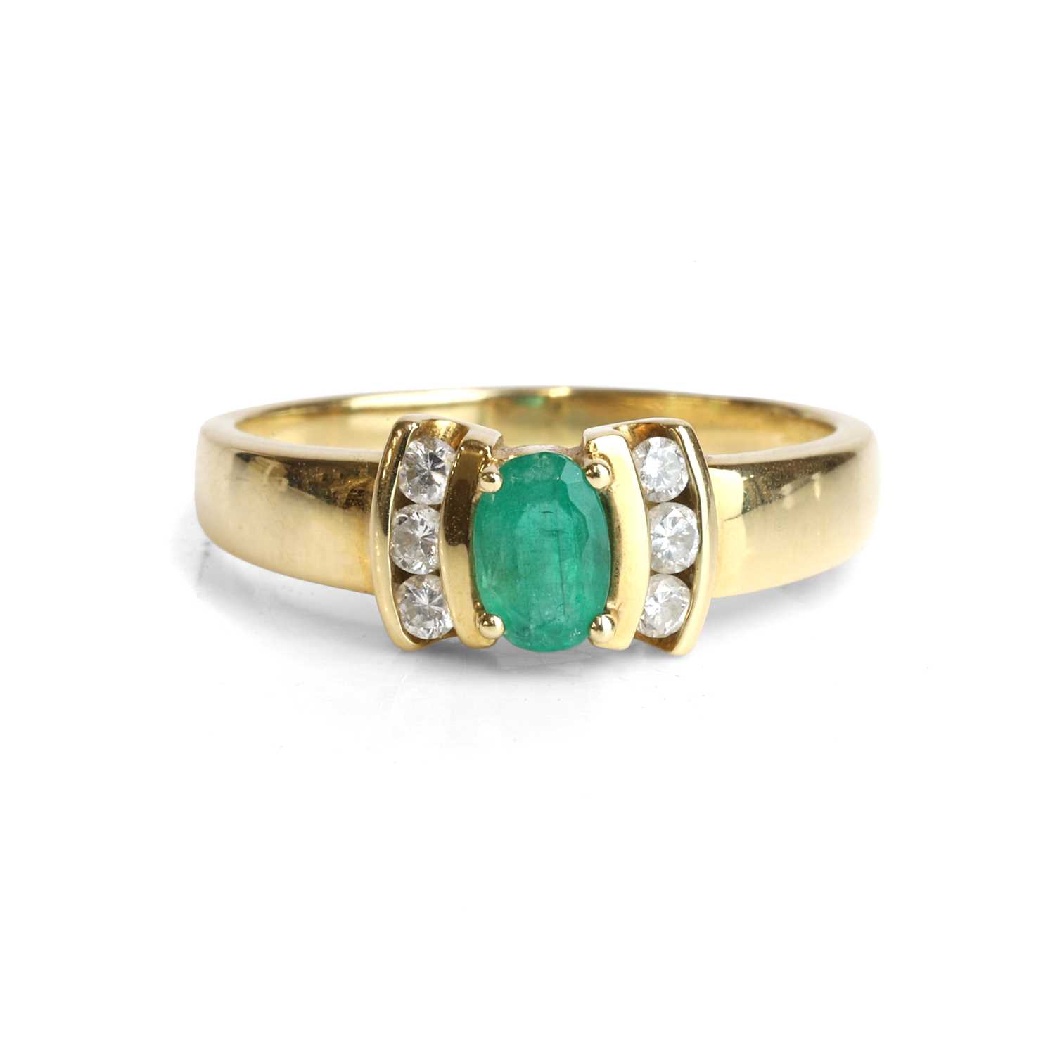 Lot 87 - An 18ct gold emerald and diamond ring