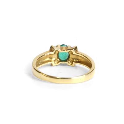 Lot 87 - An 18ct gold emerald and diamond ring
