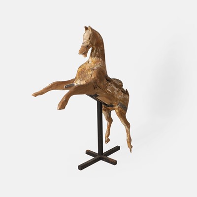 Lot 148 - A naive carved wood galloper