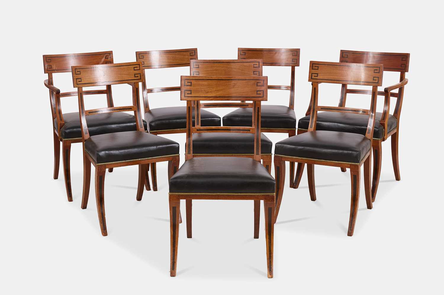 Lot 216 - A set of eight Regency mahogany klismos dining chairs