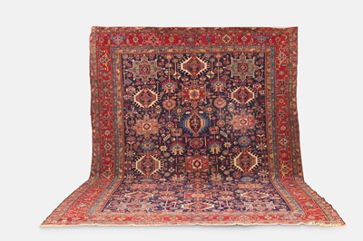 Lot 391 - A large Persian Heriz wool carpet