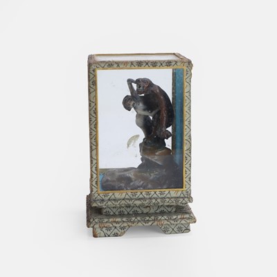 Lot 86 - A cold-painted lead figure of a gorilla holding a naked woman