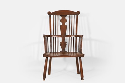 Lot 243 - An ash and elm comb-back Windsor armchair